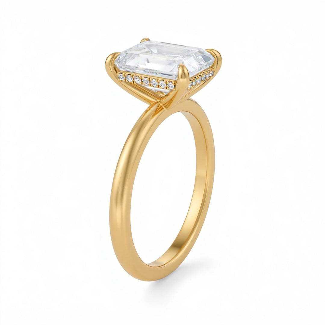 Gold ring with a large clear gemstone on a white background.