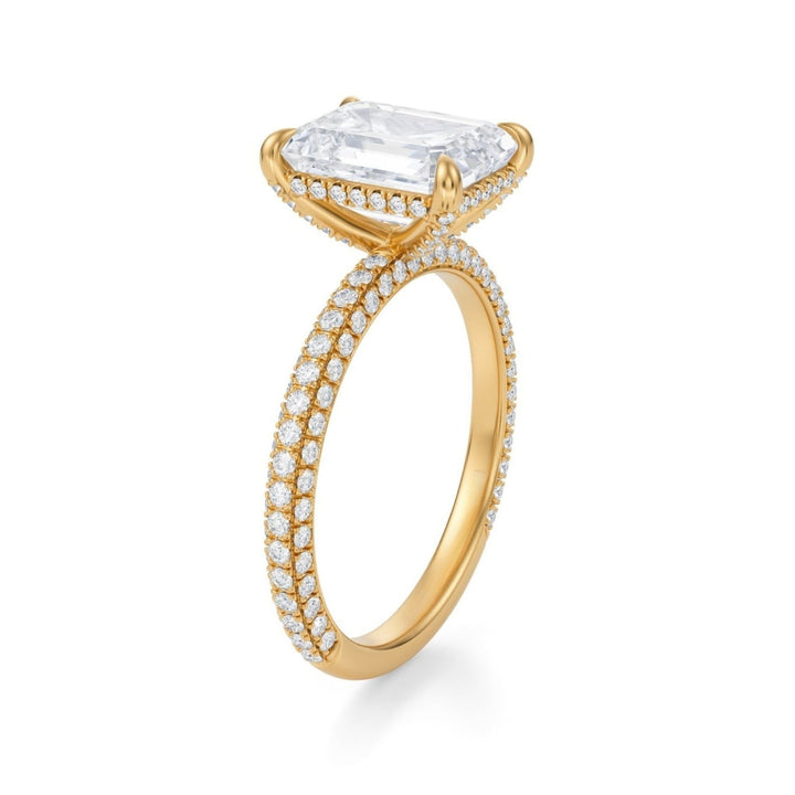 A silver ring with a central clear gemstone, possibly a diamond, surrounded by smaller diamonds set in a basket-like design.