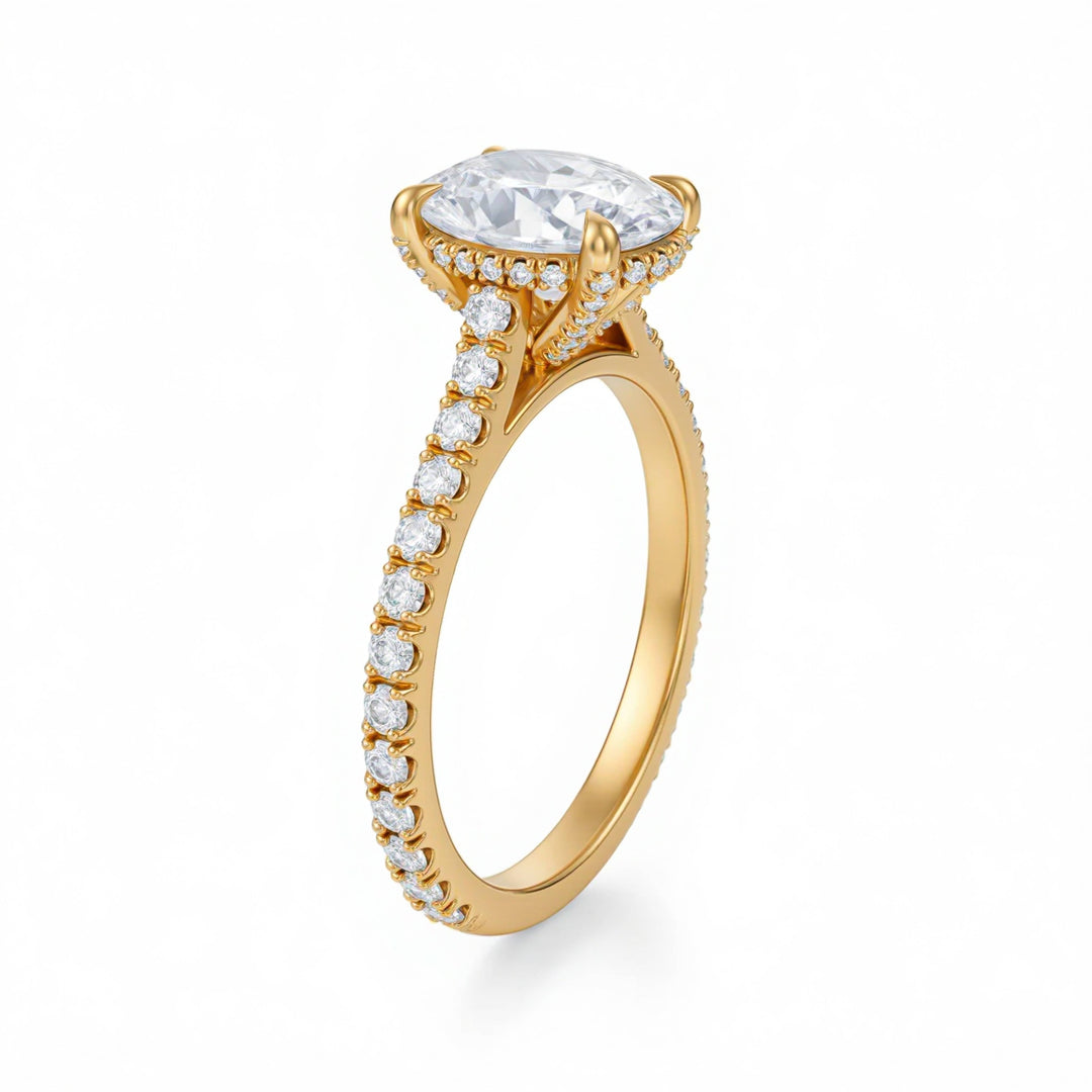 Gold ring with a large diamond and smaller diamonds on the band against a white background