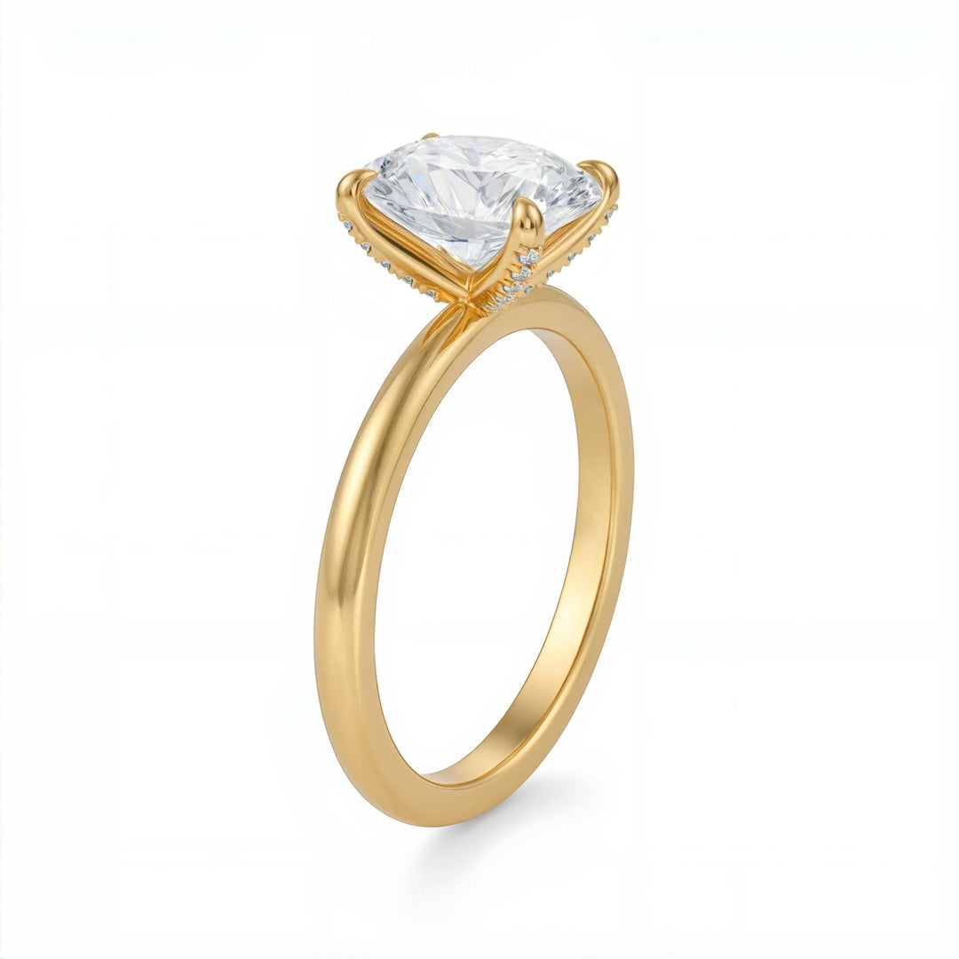 Gold ring with a clear gemstone on a white background