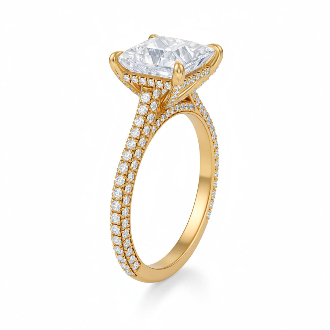 Gold ring with a large diamond and smaller diamonds on the band against a white background