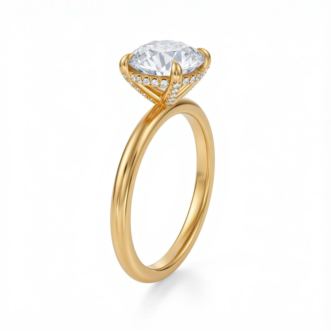 Gold ring with a large diamond and smaller diamonds on the band against a white background