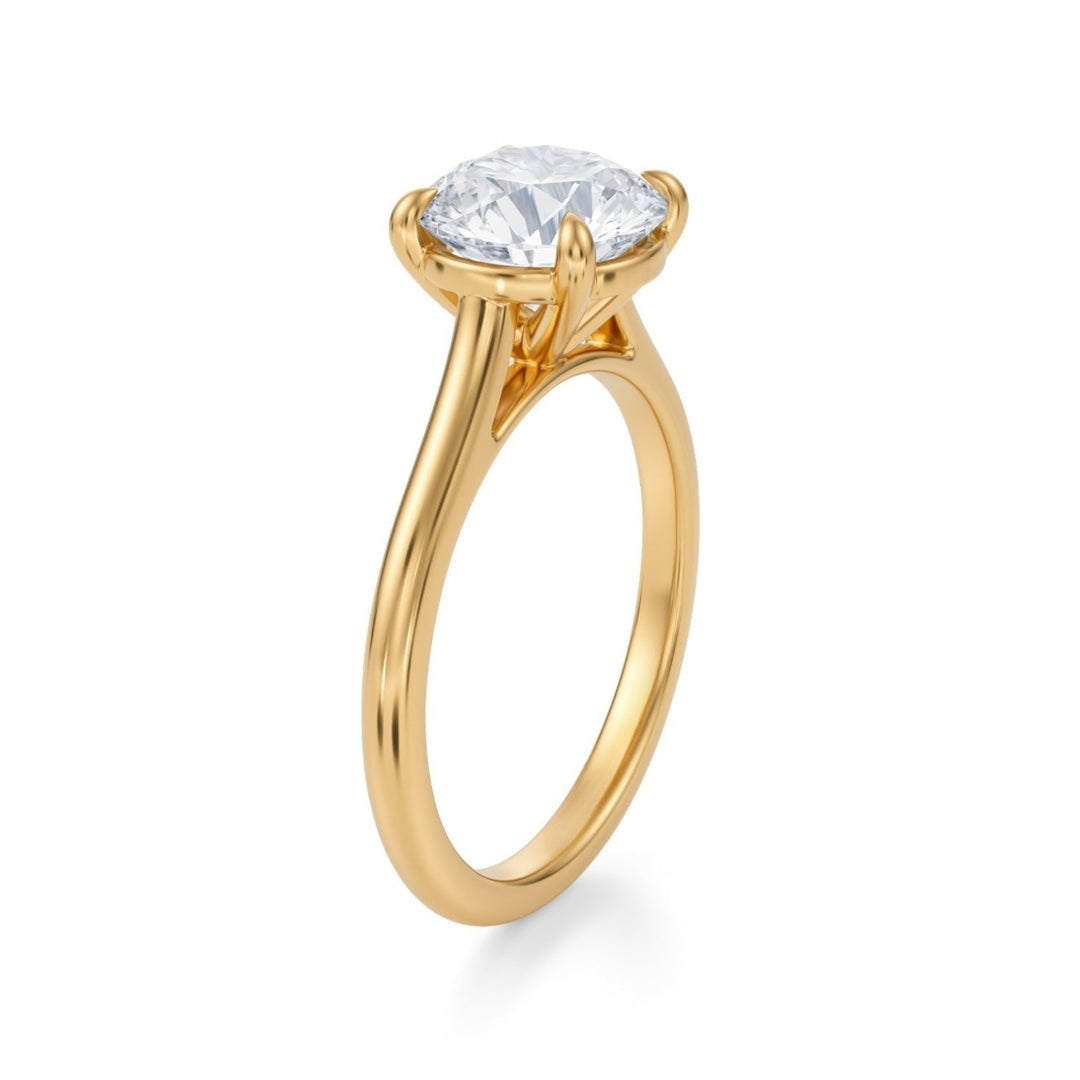 A classic round-cut diamond ring with a cathedral setting.
