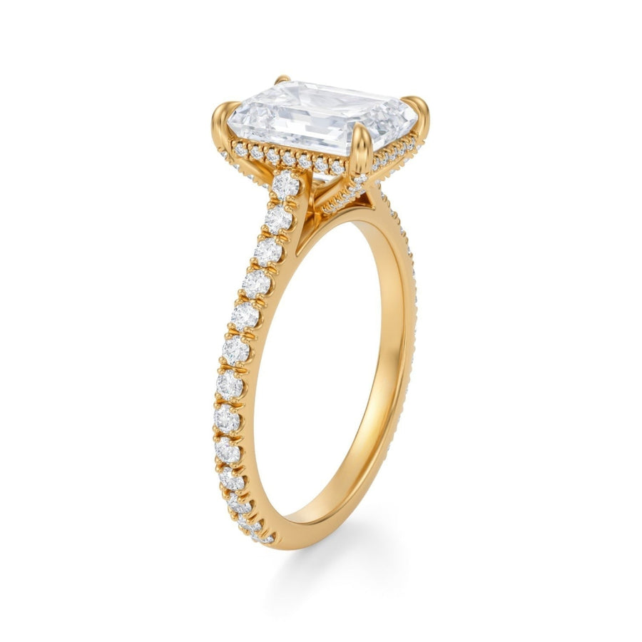 An emerald cut diamond ring with a pave band, set in a white gold or platinum setting, with the center diamond replaced by a placeholder for customization.