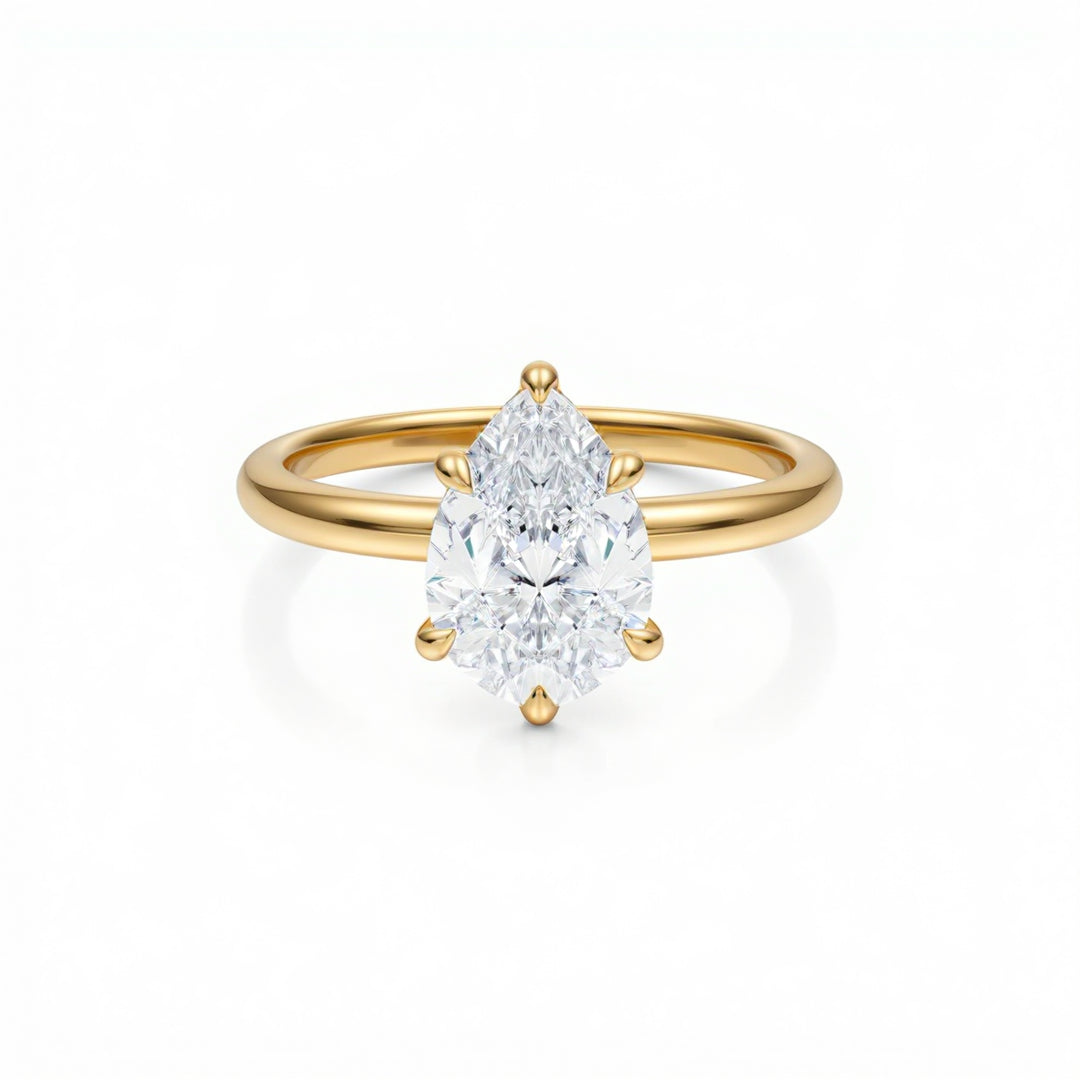 Pear Solitaire Ring With Diamond Basket