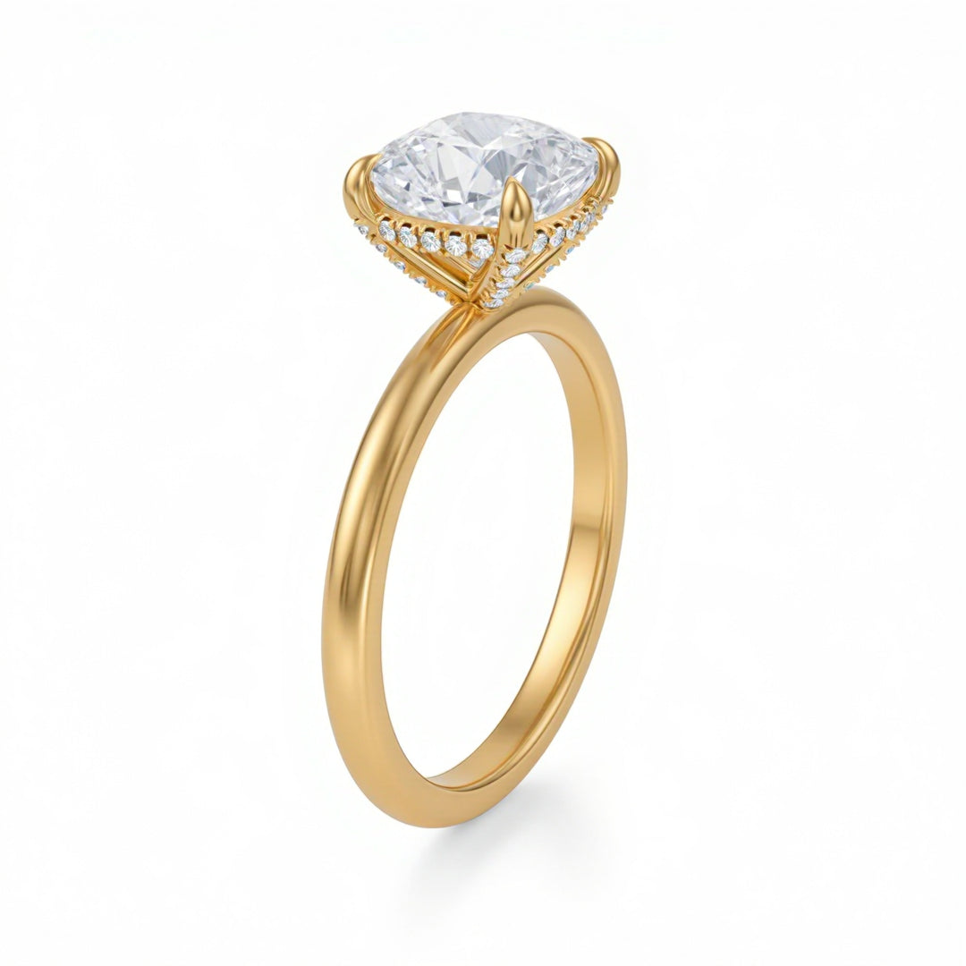 Gold ring with a large diamond and smaller diamonds on the band against a white background
