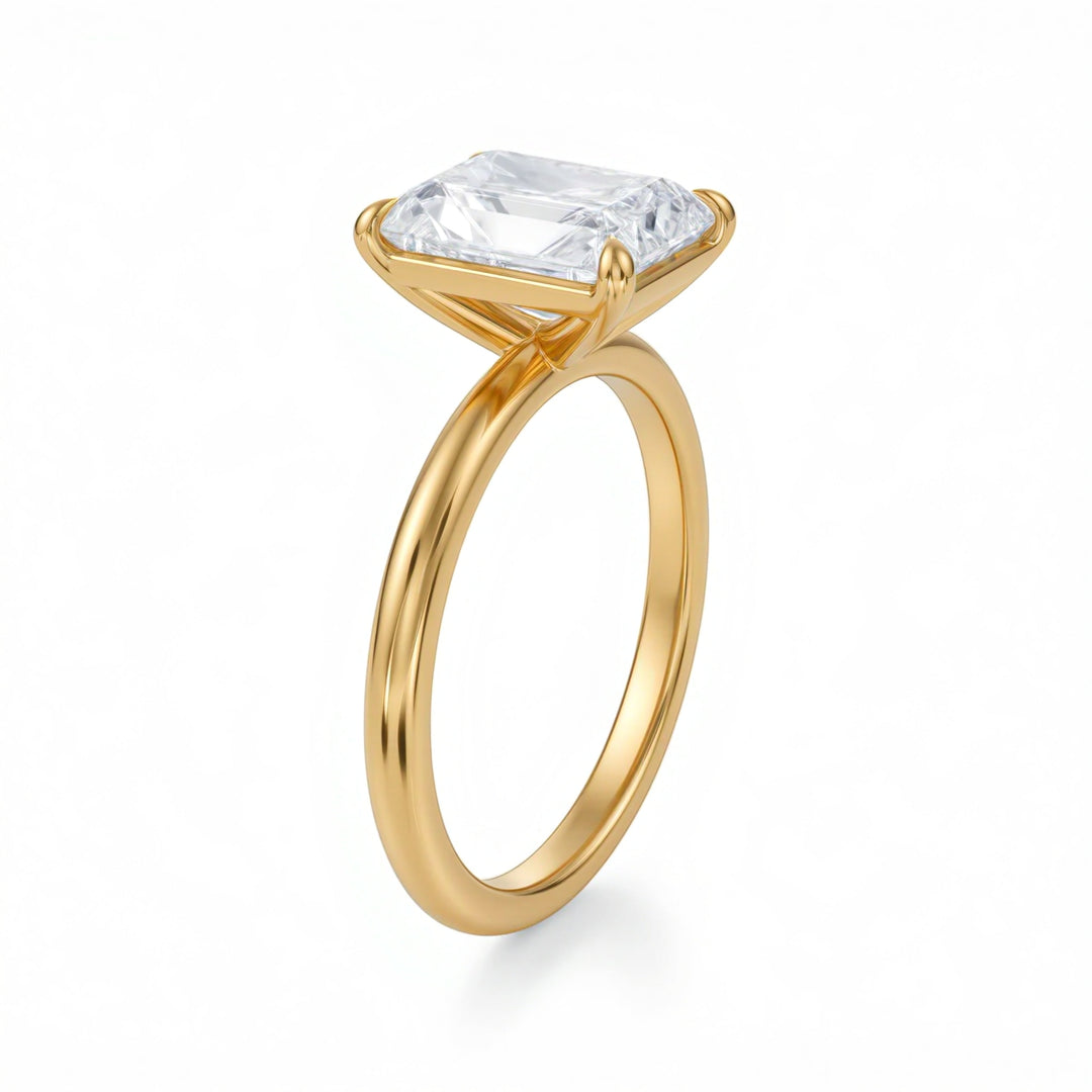 Gold ring with a large rectangular diamond on a white background