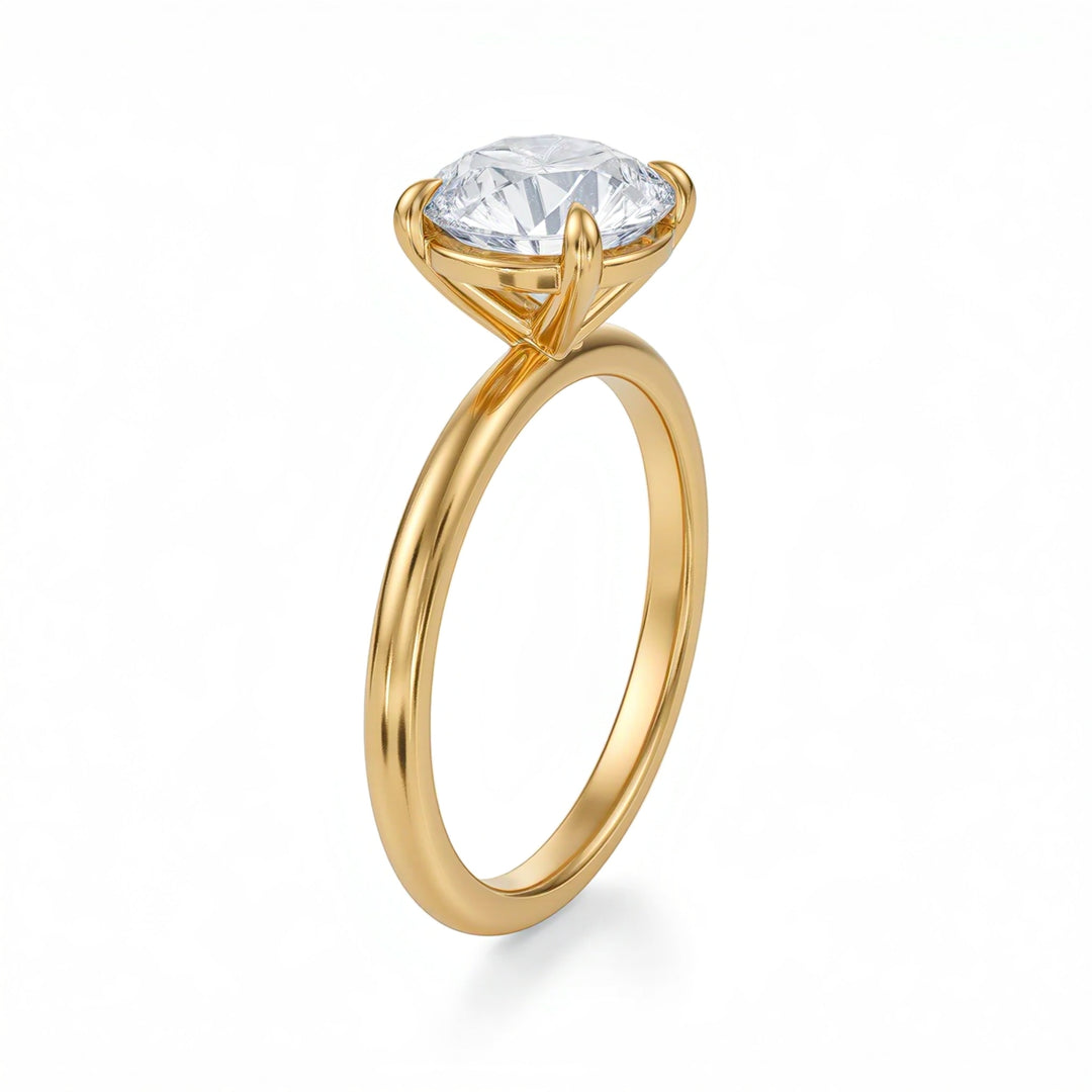 Gold ring with a clear gemstone on a white background
