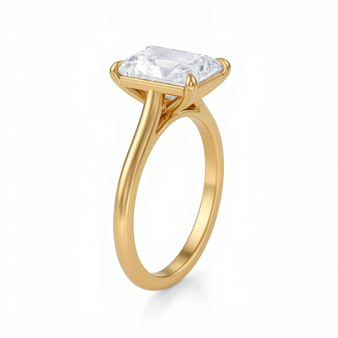 Gold ring with a large diamond on a white background