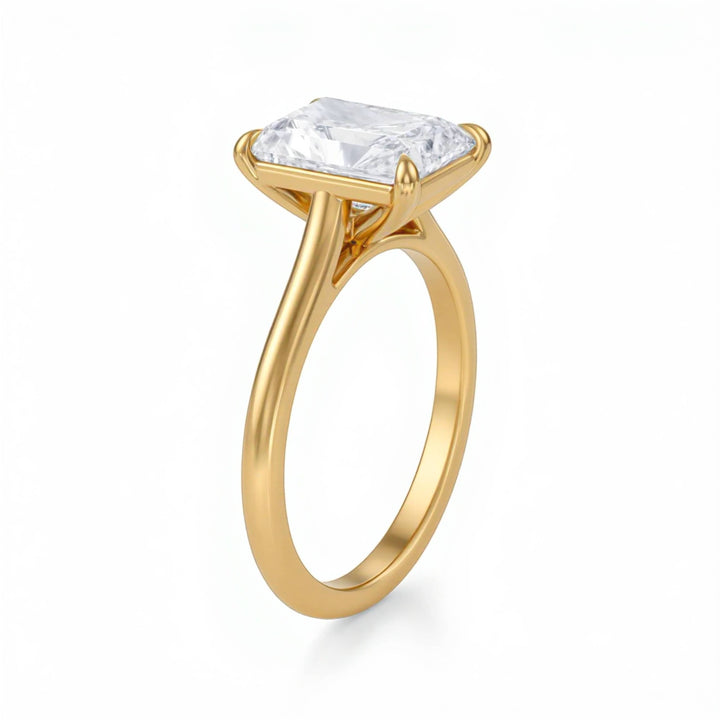 Gold ring with a large diamond on a white background