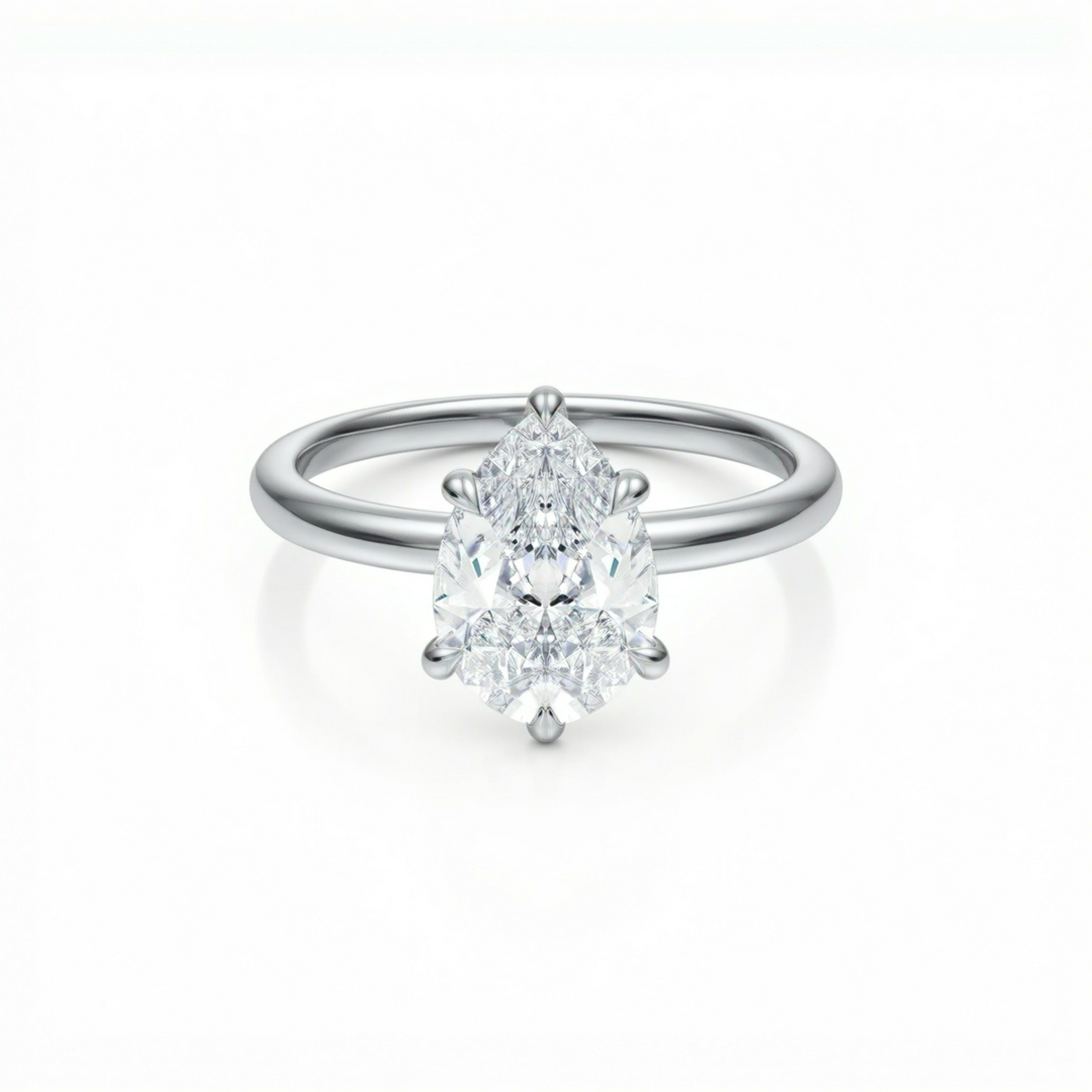 Pear Solitaire Ring With Diamond Basket