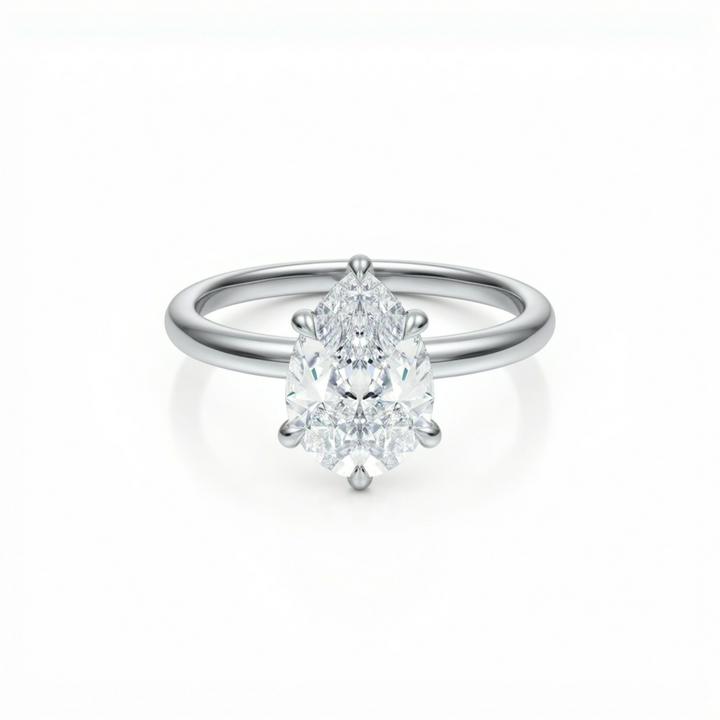 Pear Solitaire Ring With Diamond Basket