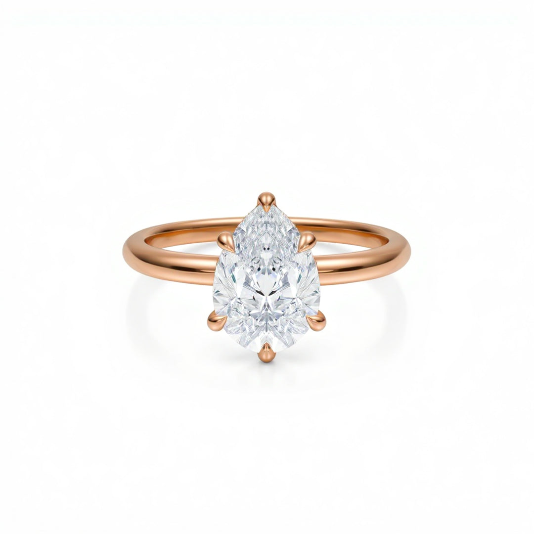 Pear Solitaire Ring With Diamond Basket