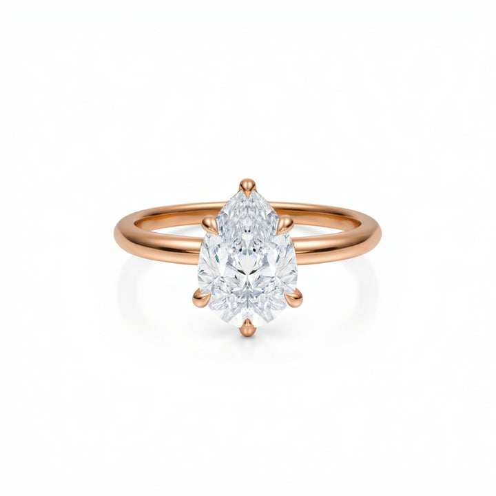 Pear Solitaire Ring With Diamond Basket