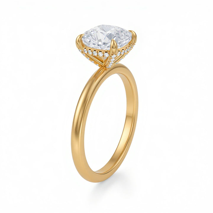 Gold ring with a large diamond and smaller diamonds on the band against a white background