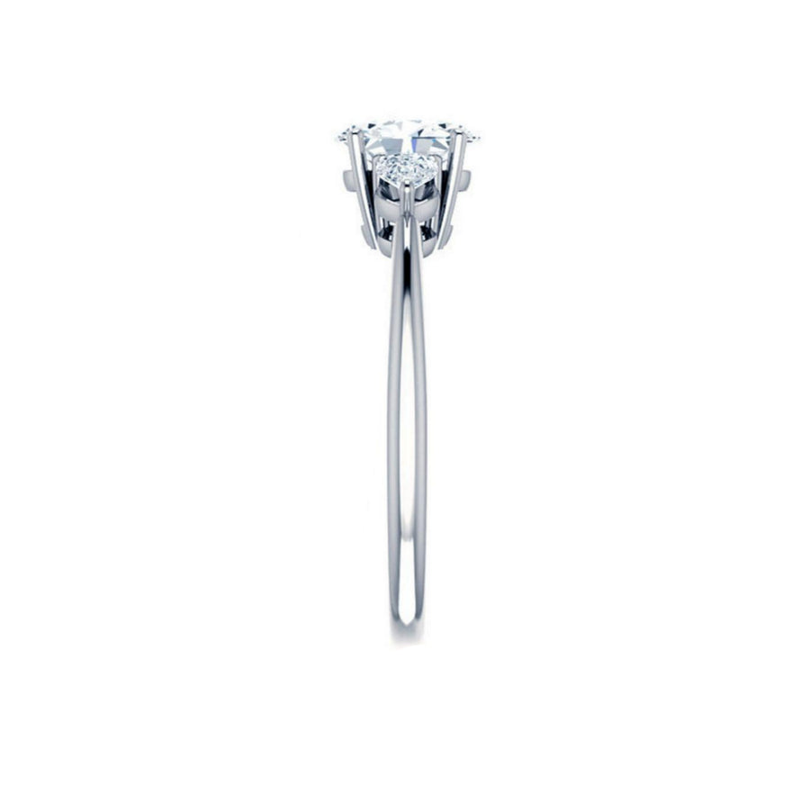 Emerald Trilogy Ring With Pear Side Stones