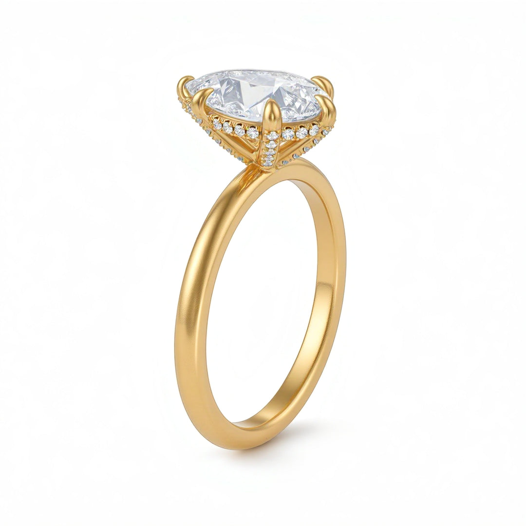 Gold ring with a large diamond and smaller diamonds on the band against a white background