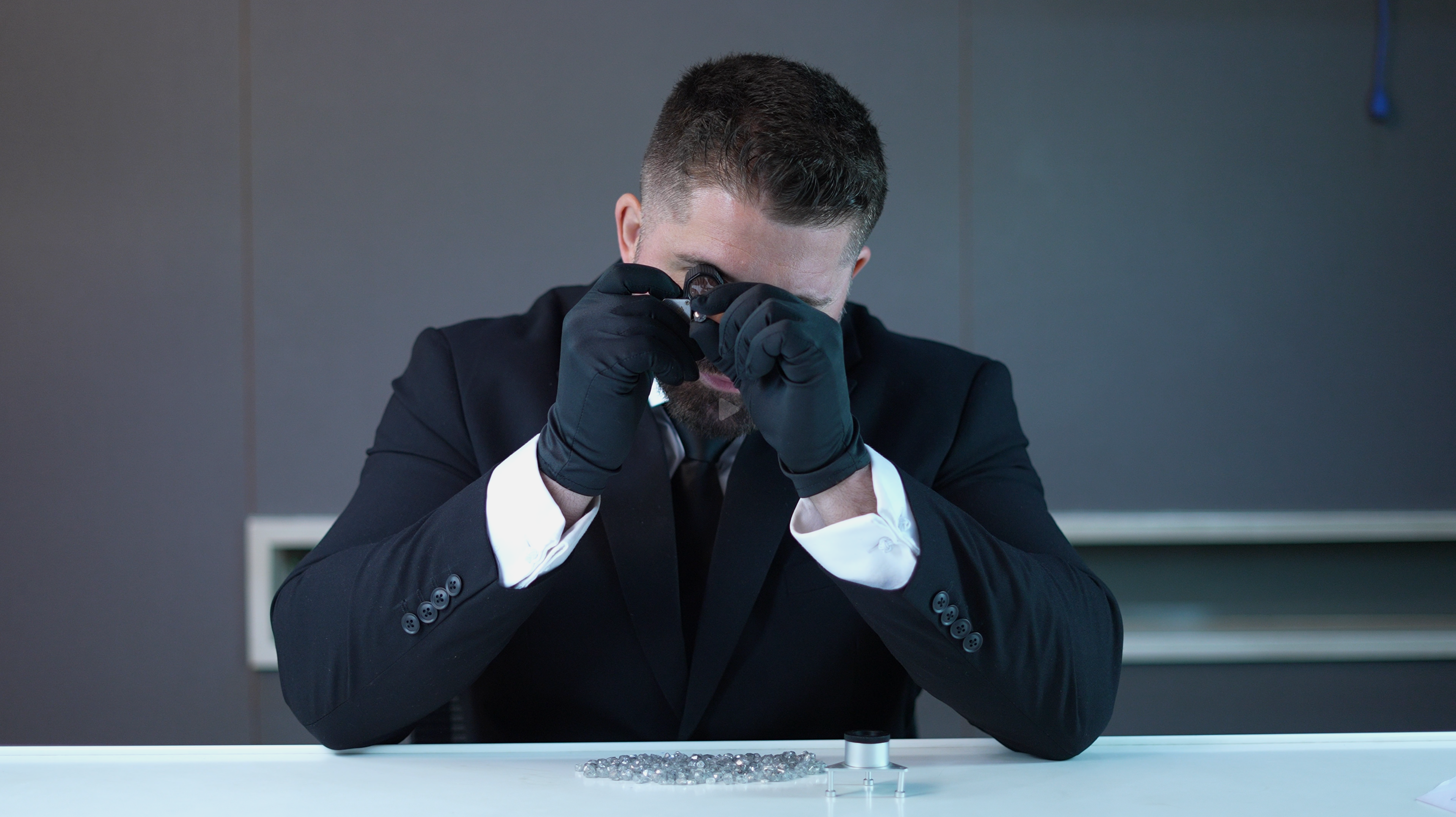 Belmir inspecting diamonds